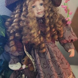 Elegant Brown Porcelain Doll with Curly Hair